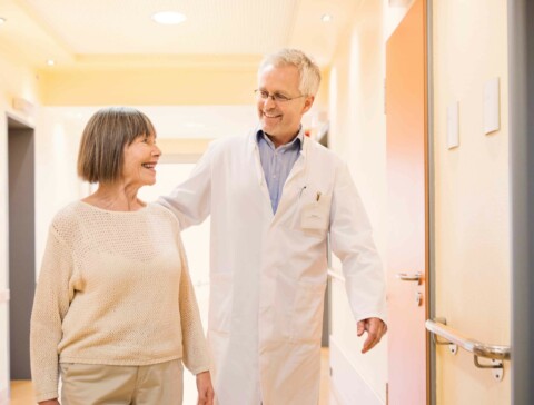 Senior caucasian doctor talking with his senior caucasian female patient