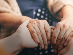 Doctor holding patient's hands